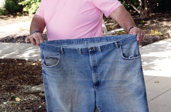 Man holding trousers