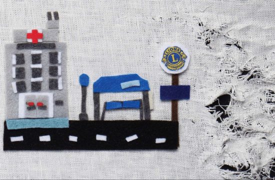 Hospital and bus stop made of felt and on unraveling fabric